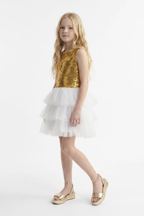 Abito Riva bianco e oro per bambina con corpetto di paillettes e gonna in tulle a strati – figura intera, vista frontale
