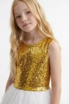 Abito Riva bianco e oro – corpetto di paillettes dorate con scollo rotondo, primo piano fino alla vita