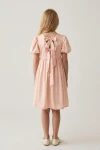 Abito Sia rosa per bambina – retro con apertura segnata da due fiocchi