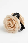 Pinza per capelli nera con rosa in tessuto beige – packshot su fondo bianco